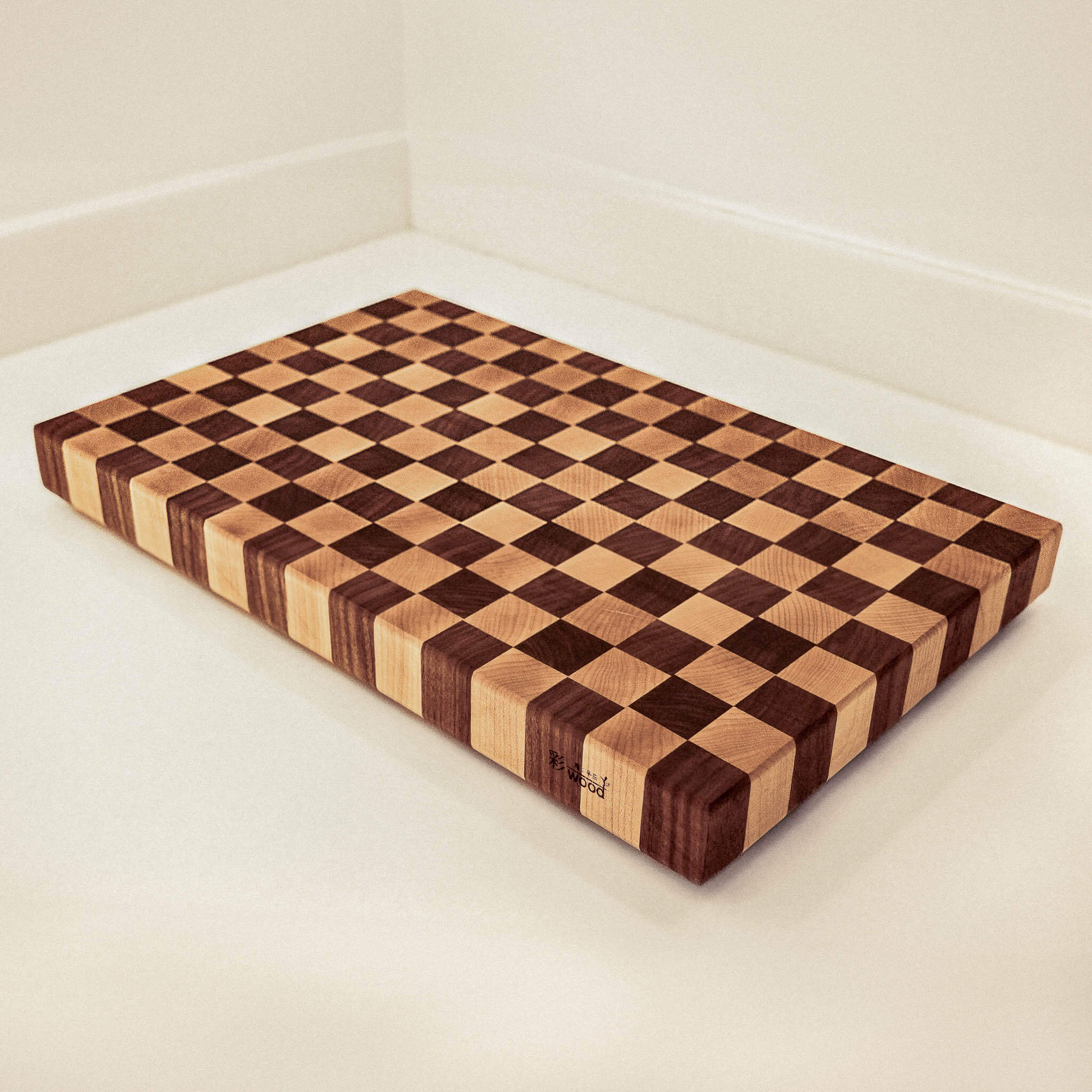Wooden cutting board with checkered pattern on a white surface