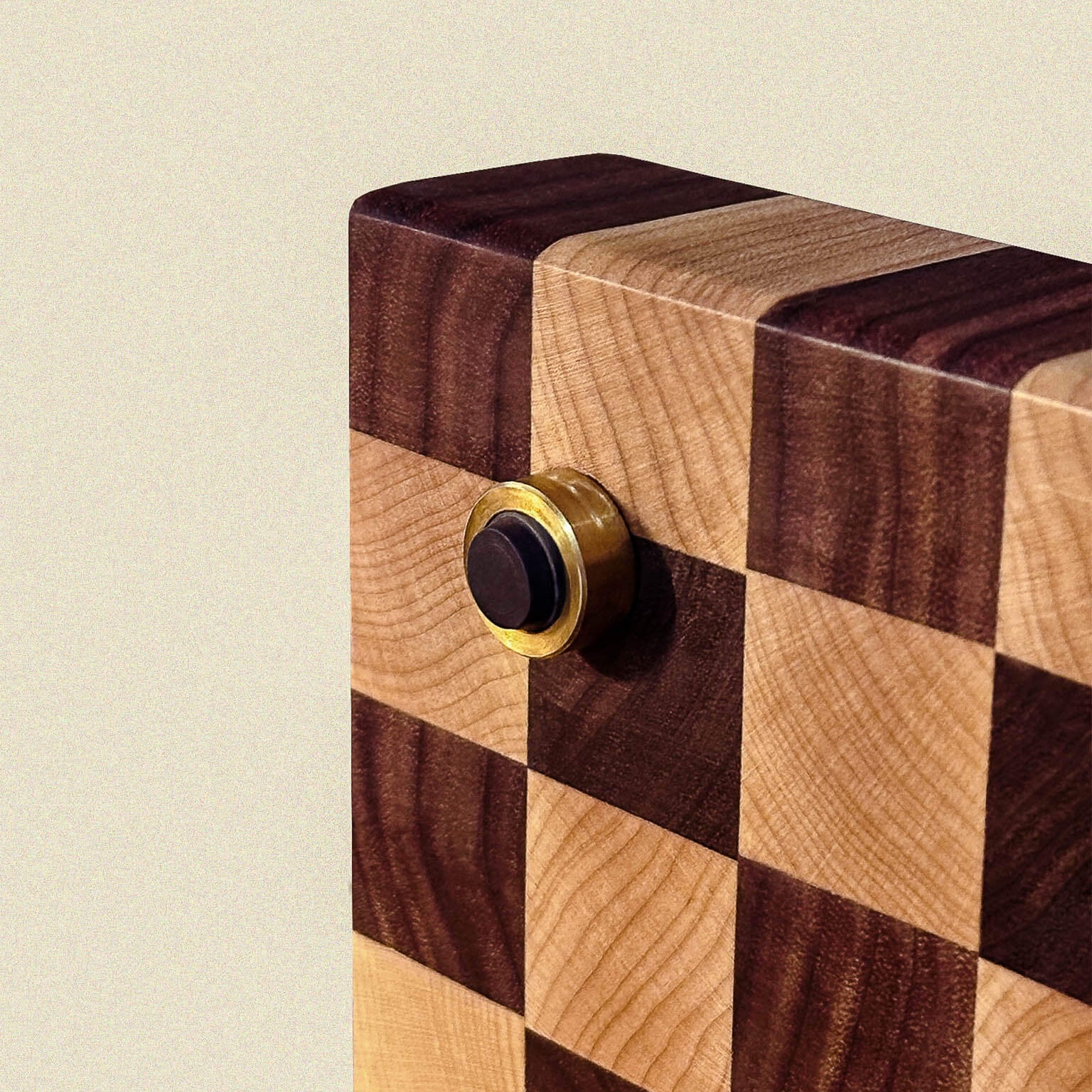Wooden board with checkered pattern and brass non-slip feet